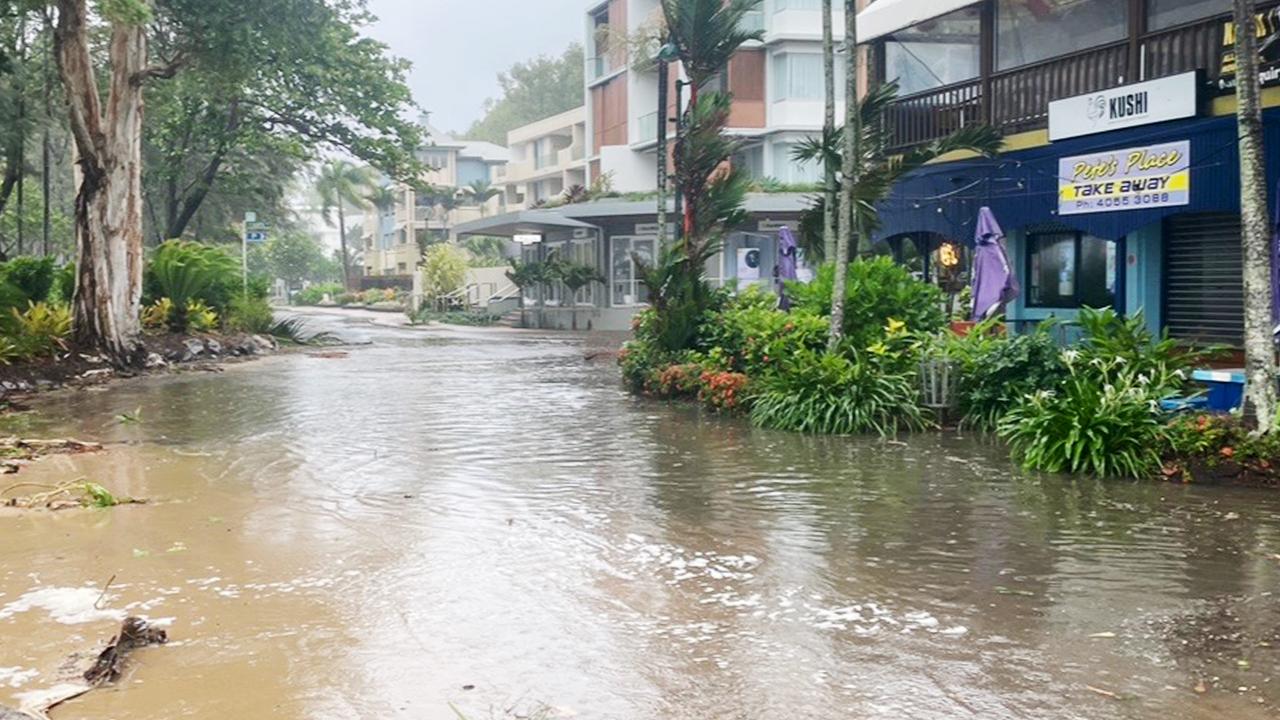 A large high tide and strong winds combined with the arrival of Tropical Cyclone Jasper in Far North Queensland to flood Williams Esplanade at Palm Cove, Cairns. Picture: Bronwyn Farr