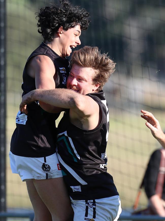 Grand final medallist Harry Warfe (left) celebrates a goal with Cody Graske. Picture: Yuri Kouzmin