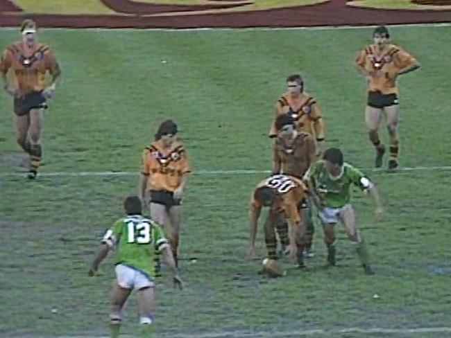 Balmain's Bruce McGuire plays the ball forward to run again because Canberra's Steve Walters was to the side of him not in front of him as a marker.