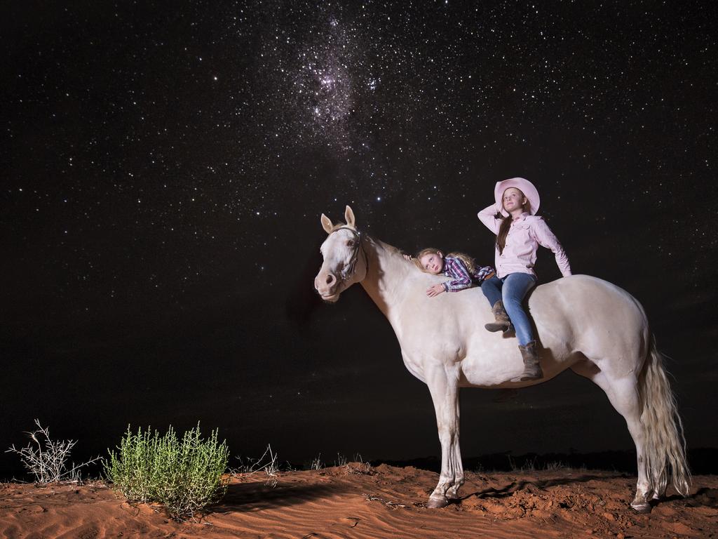 10:52pm 19-01-2015. Ash Allen, 12, and Maddi Allen, 7, have grown up around horses all their lives, their love for them is so overwhelmingly evident. The sisters show more control and experience than most adults, even able to lay a horse down with a few gentle words and a tap. Picture: Jason Edwards