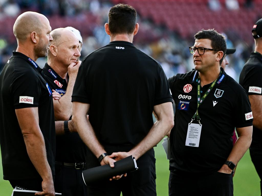 Ken Hinkley and Josh Carr chat with other Power assistants. Picture: Mark Brake/Getty Images