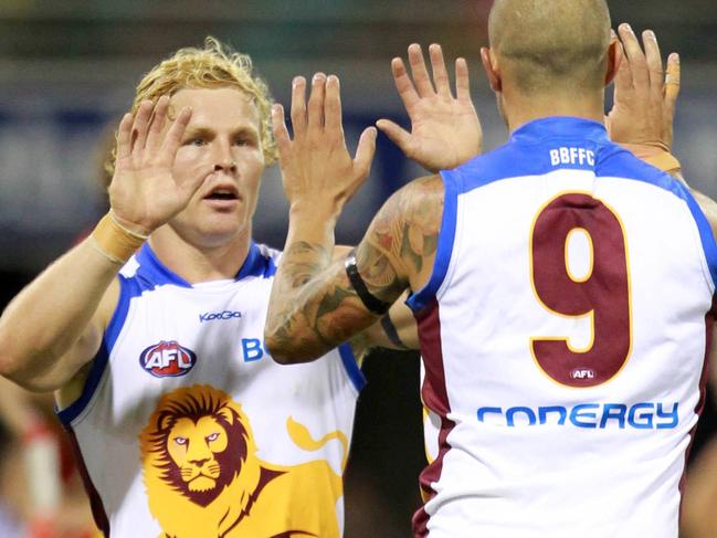 SPORT.BCM. 7/5/11. Ashley Mcgrath of the Lions celebrates a goal with Daniel Rich during the AFL match between the Gold Coast Suns and the Brisbane Lions played at the Gabba. Pic Darren England.