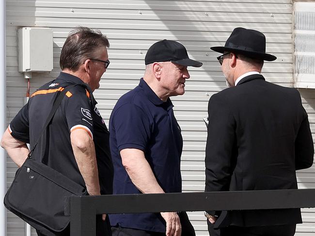 Wests Tigers new head of football Tim Sheens (wearing cap) arrives for his first day at work after flying in from the UK last night, pictured arriving at Tigers administration in Concord where he was met by chairman Lee Hagipantelis (R). Picture: Toby Zerna