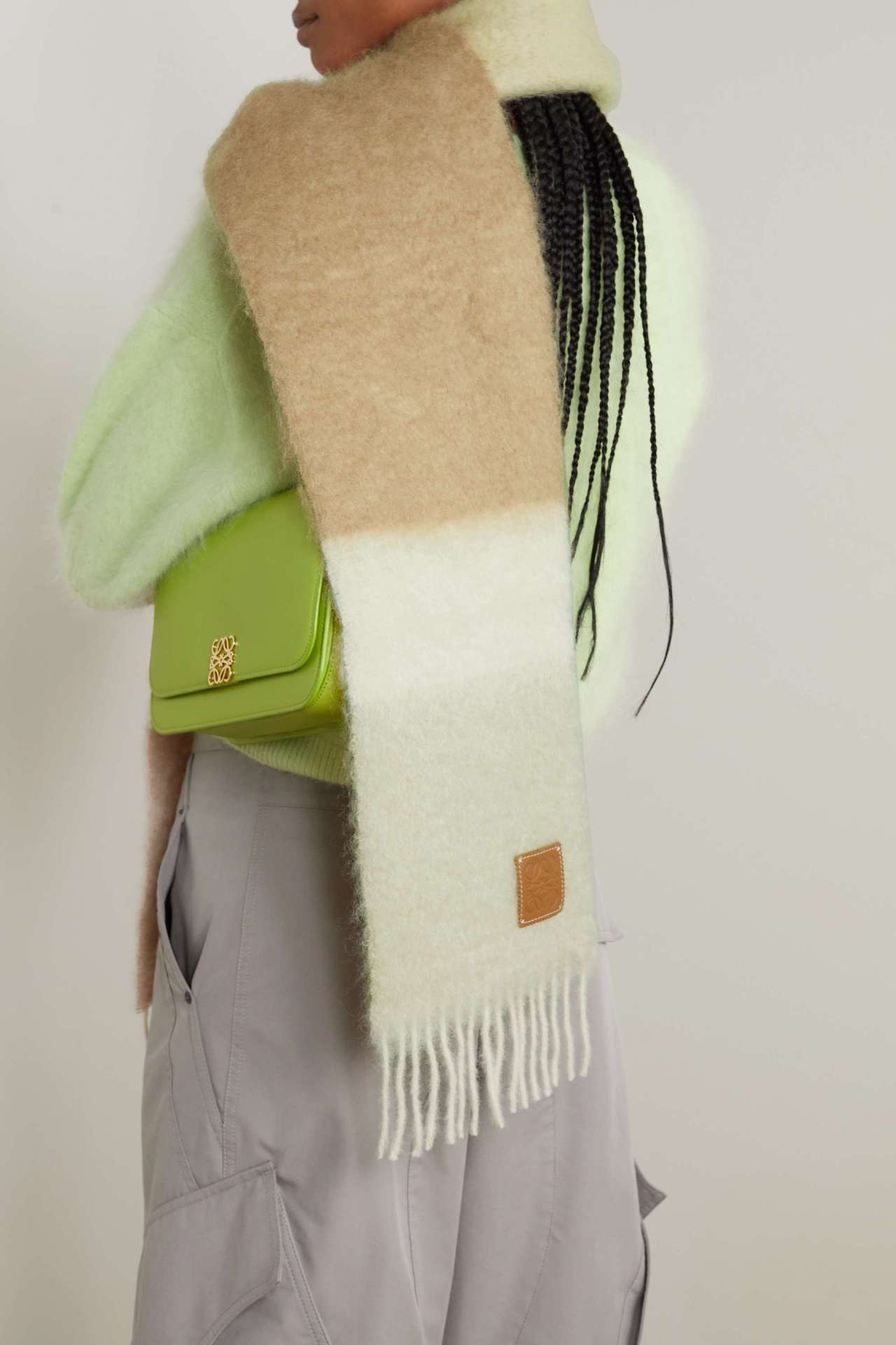 <p>A statement scarf is essential. </p><p><strong>SHOP NOW:</strong> Loewe fringed mohair scarf, $510 from <a href="https://www.net-a-porter.com/en-au/shop/product/loewe/accessories/scarves/fringed-striped-mohair-blend-scarf/1647597317038417" target="_blank" rel="nofollow noopener"><strong>Net-a-Porter</strong></a></p>