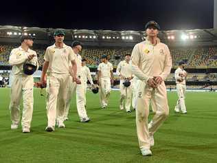 Australian captain Steve Smith leaves the field at stumps on day four at the Gabba. Picture: DAVE HUNT