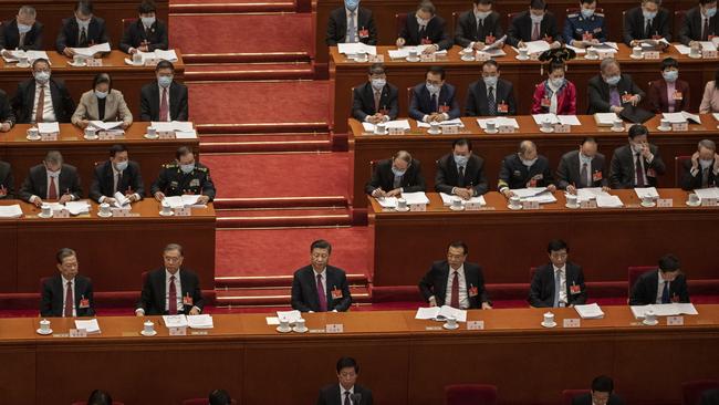 Chinese President Xi Jinping and members of the government gather during the opening session of the National People's Congress at the Great Hall of the People on March 5. Picture: Kevin Frayer/Getty