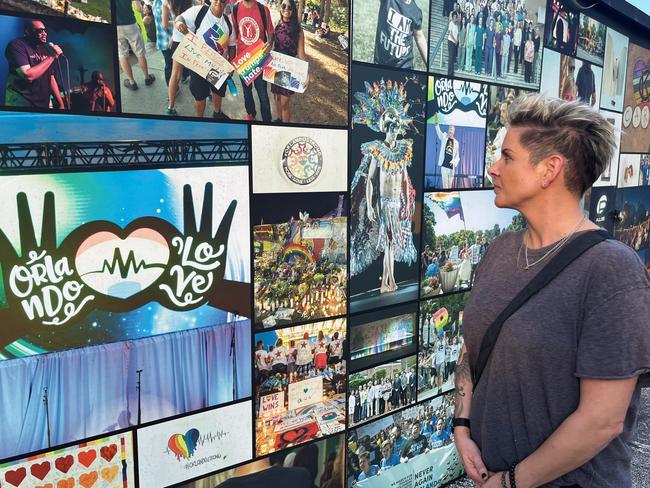 Kate Maini looks at some of the messages at the Pulse nightclub memorial site. Picture: Benedict Brook