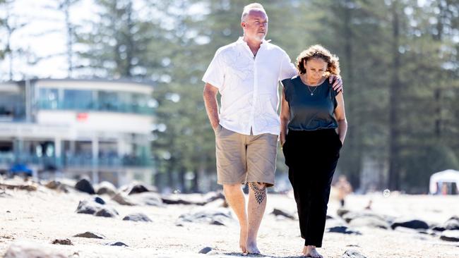 Chris and Sonia Duce walk Burleigh Heads - Cam’s special place which they want to see become safer. Picture: Luke Marsden