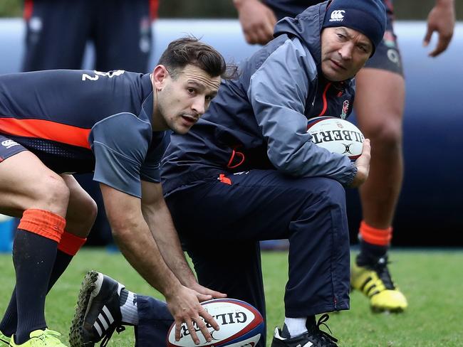 BAGSHOT, ENGLAND - FEBRUARY 22:  Danny Care, looks to pass the ball as head coach Eddie Jones, looks on during the England training session held at Pennyhill Park on February 22, 2017 in Bagshot, England.  (Photo by David Rogers/Getty Images)