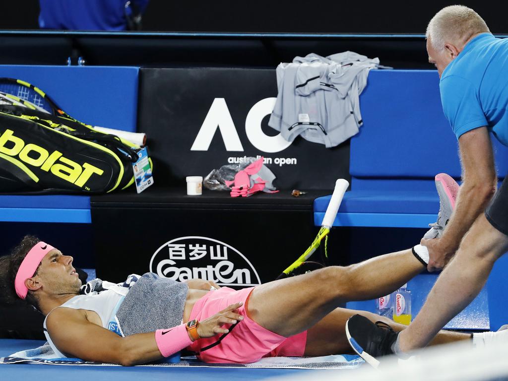 The world held its breath when Rafa Nadal went down injured during his quarter-final with Marin Cilic. Pic: Michael Klein