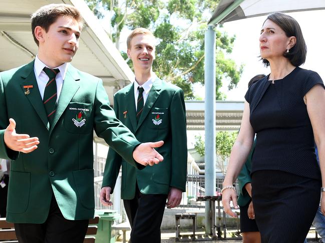 NSW Premier Gladys Berejiklian along with Education Minister Rob Stokes (right) are shown around by School Captain Maximus Kypriotis (left) during a visit to Heathcote High School, at Heathcote, south of Sydney, Tuesday, January 29, 2019. (AAP Image/Dan Himbrechts) NO ARCHIVING