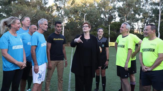 Foreign Affairs Minister Marise Payne and Hakeem al-Araibi, at a friendly football match to welcome Mr Araibi back to Australia. Picture: Kym Smith