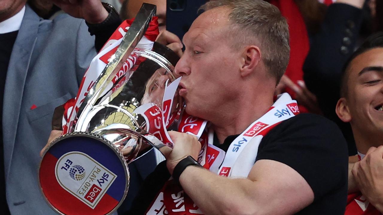 Steve Cooper turned the club around after a horrific start to the season. (Photo by Adrian DENNIS / AFP)