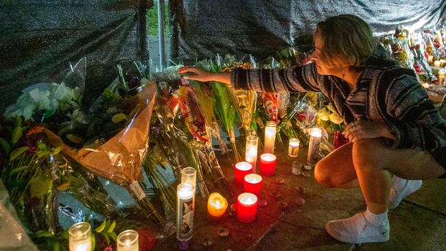 Hannah Longoria attends a makeshift memorial at the NRG Park grounds where eight people died in a crowd surge at the Astroworld Festival in Houston, Texas.