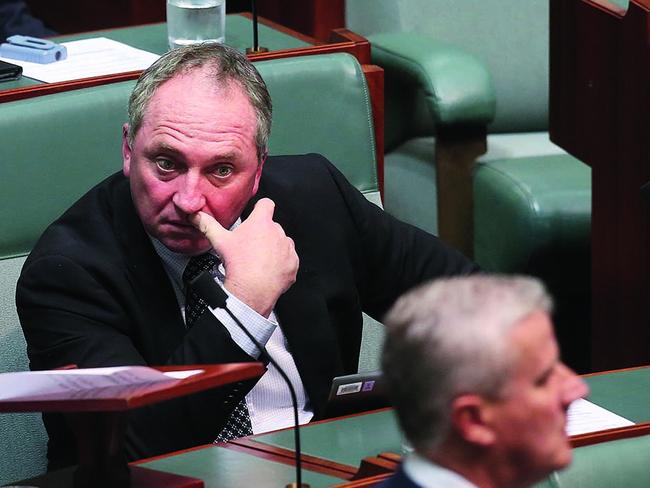 Barnaby Joyce looks on as Deputy PM and Nationals Leader Michael McCormack arrives for Question Time in August. Picture Kym Smith