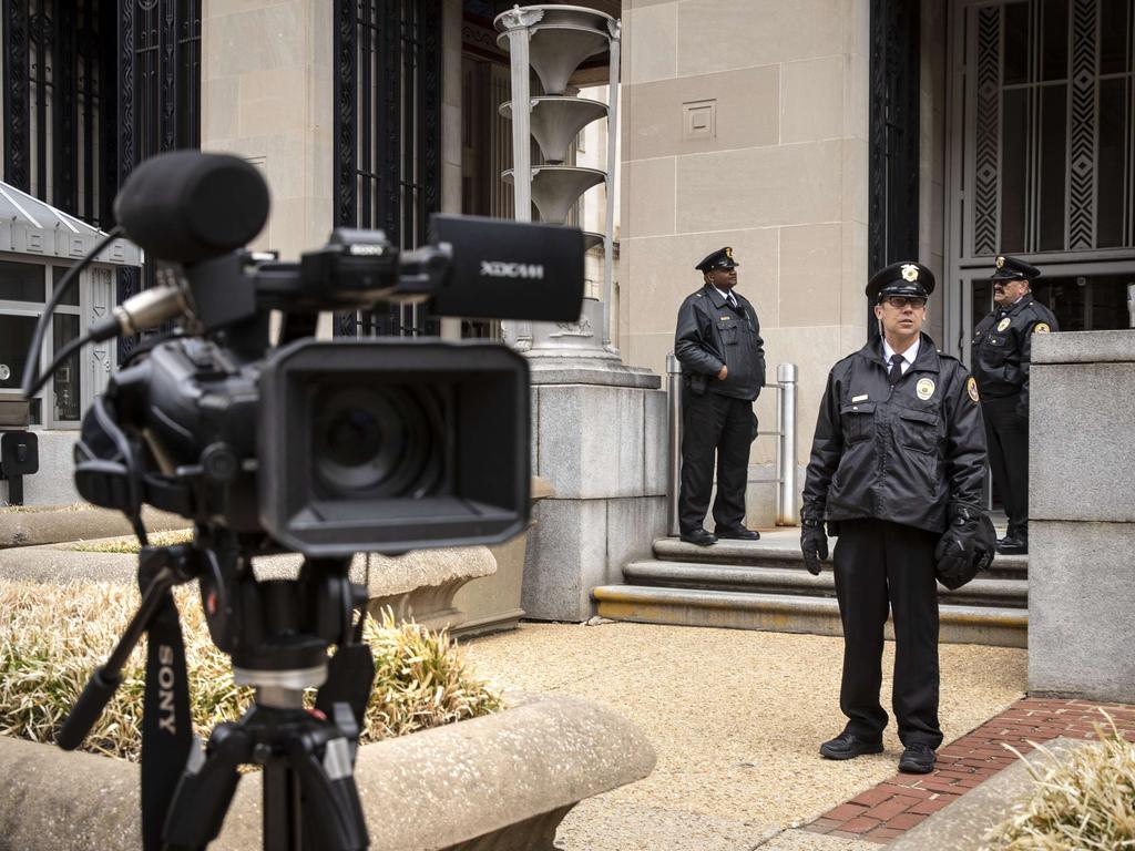 Security officials outside the Department of Justice in Washington today. Picture: AFP 