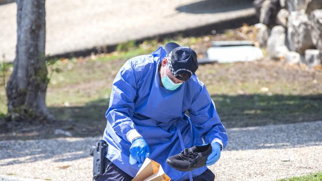 Queensland police investigating death at The Promenade, Springfield Lakes, collecting evidence in nearby Atlantic Drive, today.(AAP Image/Richard Walker)