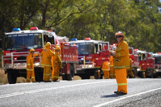 Volunteer fire crews plan containment lines on the Mid North Coast. Picture: DAN HIMBRECHTS