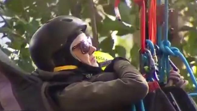 A woman is winched down from a tree after a hang-gliding accident on Mount Tamborine. Picture: Channel 7