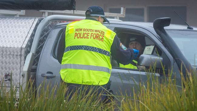 NSW police check drivers arriving on the NSW side of the border in Moama. Picture: Jake Nowakowski