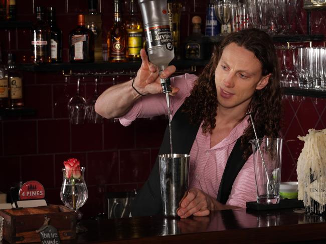 Cocktail barman Fraser Hill working away at the Stowaway bar.