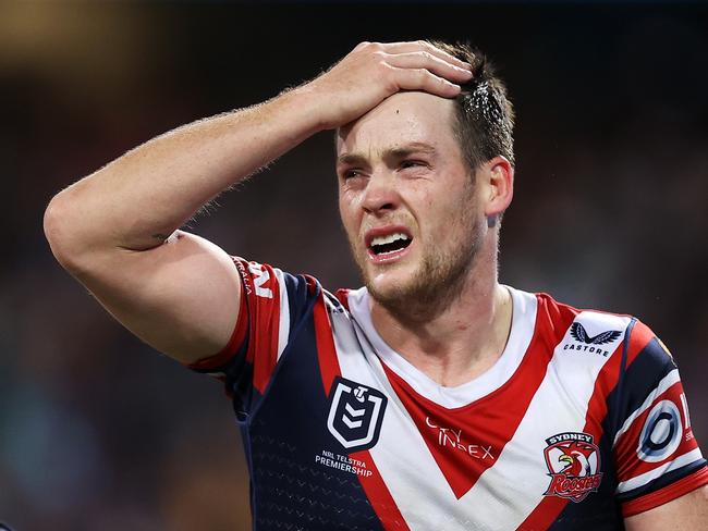 SYDNEY, AUSTRALIA - JUNE 11: Luke Keary of the Roosters holds his head as he leaves the field for an HIA during the round 14 NRL match between the Sydney Roosters and the Melbourne Storm at Sydney Cricket Ground, on June 11, 2022, in Sydney, Australia. (Photo by Mark Kolbe/Getty Images)