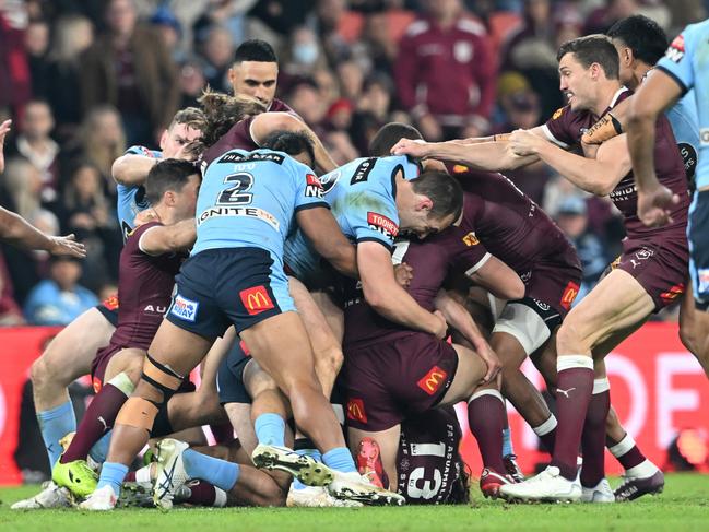 Matt Burton and Dane Gagai come together. Picture: Bradley Kanaris/Getty