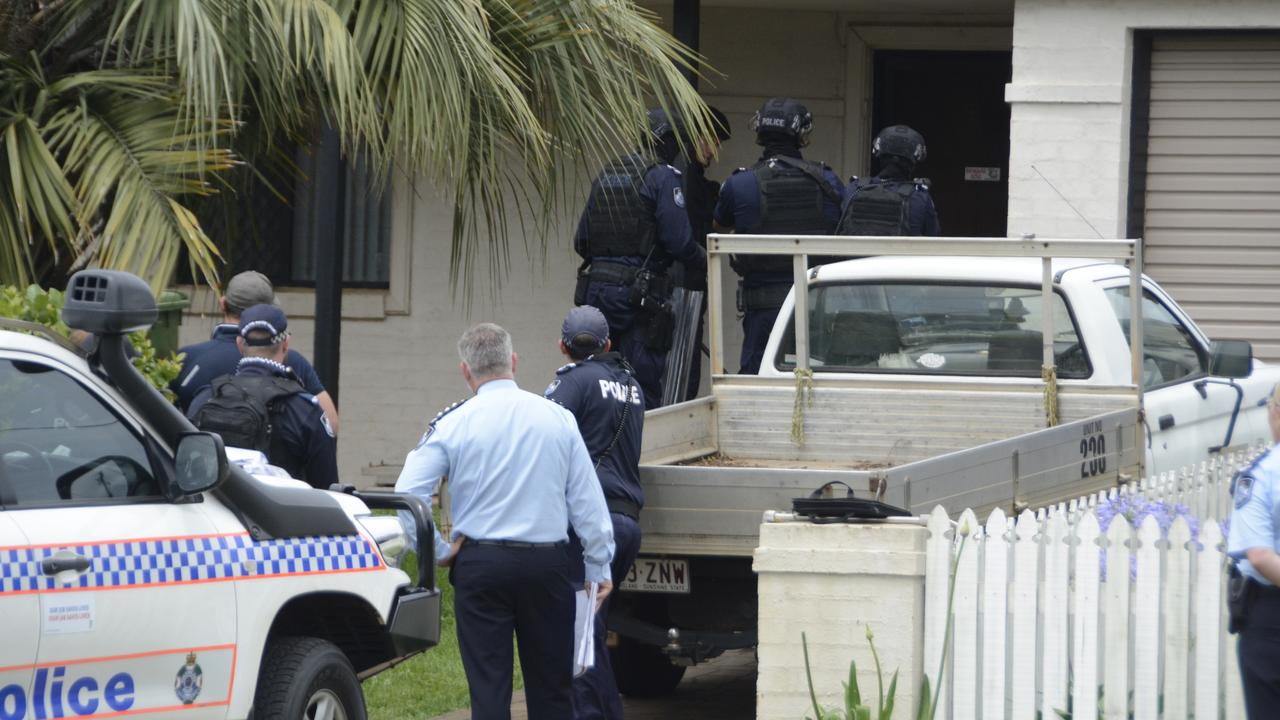 Queensland Police Public Safety Response Team gain entry to a South Toowoomba home during a five-hour stand-off. Photo: Jarrard Potter.