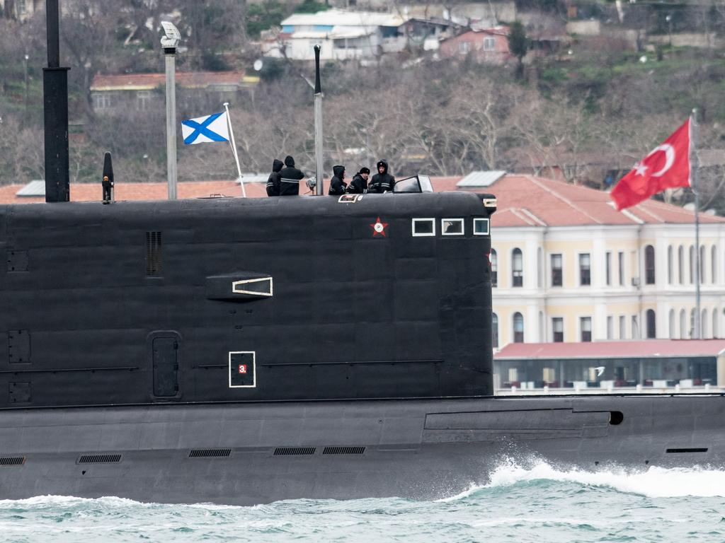 Russian sailors stand on the bridge of the Russian Navy’s Kilo-class submarine as it transits the Bosphorus Strait in Istanbul. Picture: Getty Images