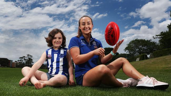 Nina Johnston, 7, of Hobart, with AFLW North Melbourne player Nicole Bresnehan at AFLW North Melbourne clinic at Sandy Bay. Picture: NIKKI DAVIS-JONES