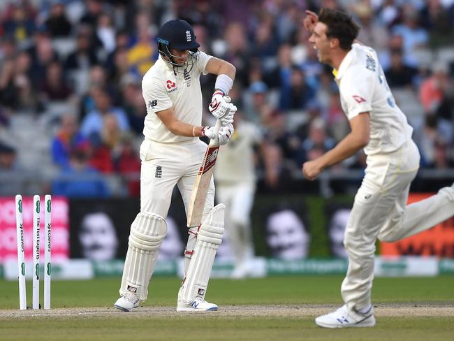 MANCHESTER, ENGLAND - SEPTEMBER 07: England captain Joe Root is bowled by Pat Cummins of Australia during day four of the 4th Specsavers Ashes Test match between England and Australia at Old Trafford on September 07, 2019 in Manchester, England. (Photo by Gareth Copley/Getty Images)