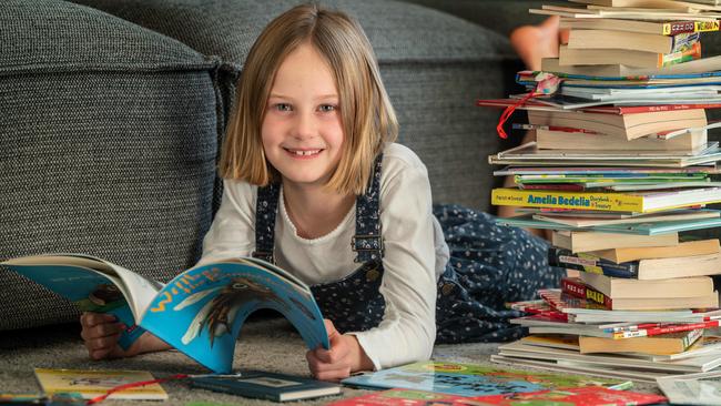 Macy Jeffrey, 8, is a much bigger bookworm than her parents were at her age. Picture: Tony Gough