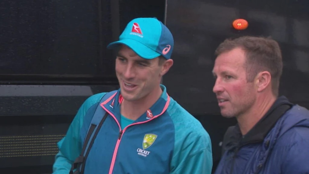 Former Socceroo Lucas Neill alongside Australian Test captain Pat Cummins after day five at Old Trafford. Photo: Nine