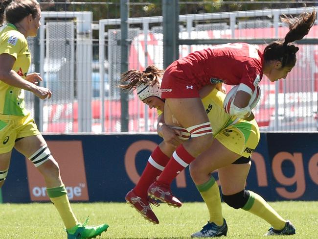 Canada's Bianca Farella is tackled by Australia's Sharni Williams in France during a sevens world series event.