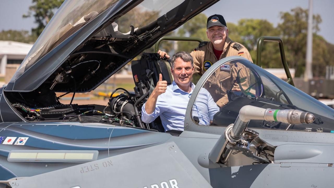 Defence Minister Richard Marles sits in a German Air Force Eurofighter Typhoon with Colonel Gordon Schnitger during a visit to RAAF Base Darwin last week.