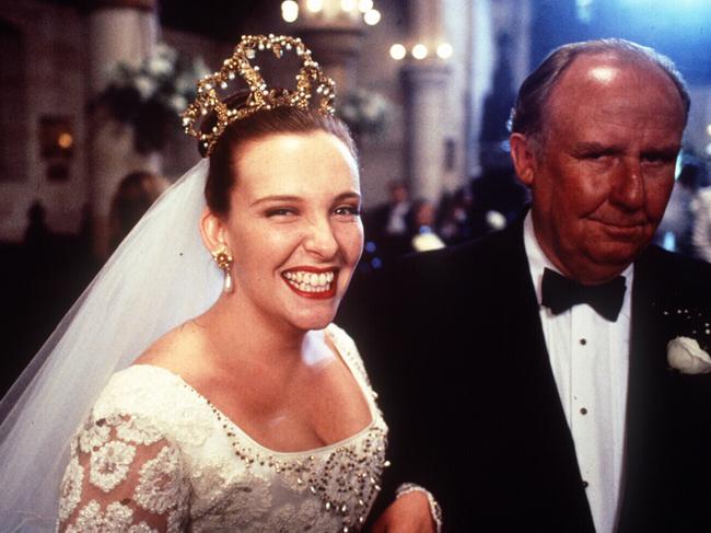 Toni Collette and Bill Hunter in Muriel's Wedding.