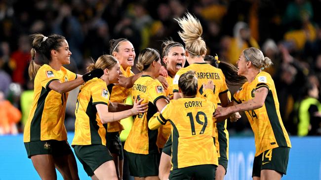 Catley celebrates with teammates. Picture: Bradley Kanaris/Getty Images