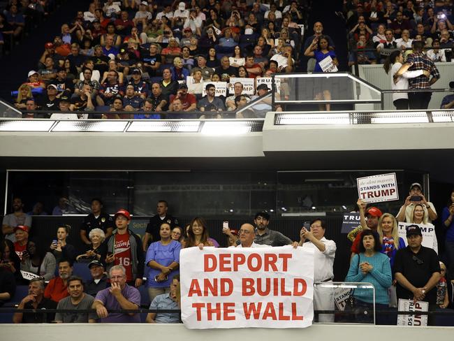 People listen to Republican presidential candidate Donald Trump during a rally at Anaheim. Picture: AP