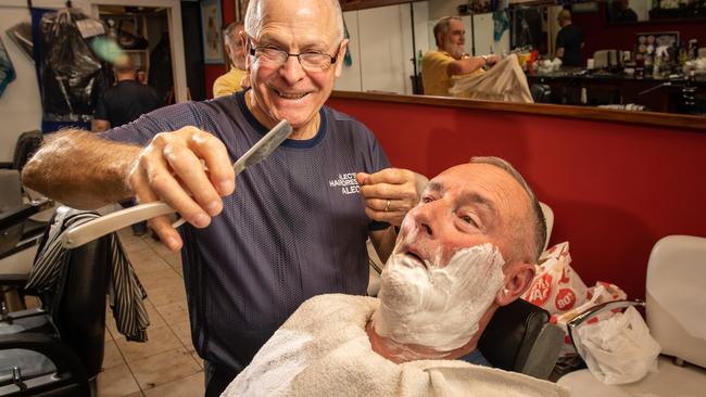 Leigh St Barber Alec Mastrangelo is celebrating 45 years of business in the Adelaide laneway. Picture: Brad Fleet