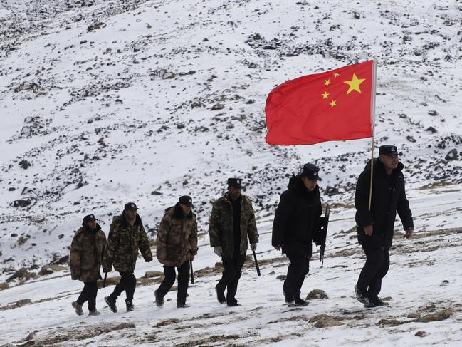 Border police officers patrol the strip of land that connects Afghanistan to China.