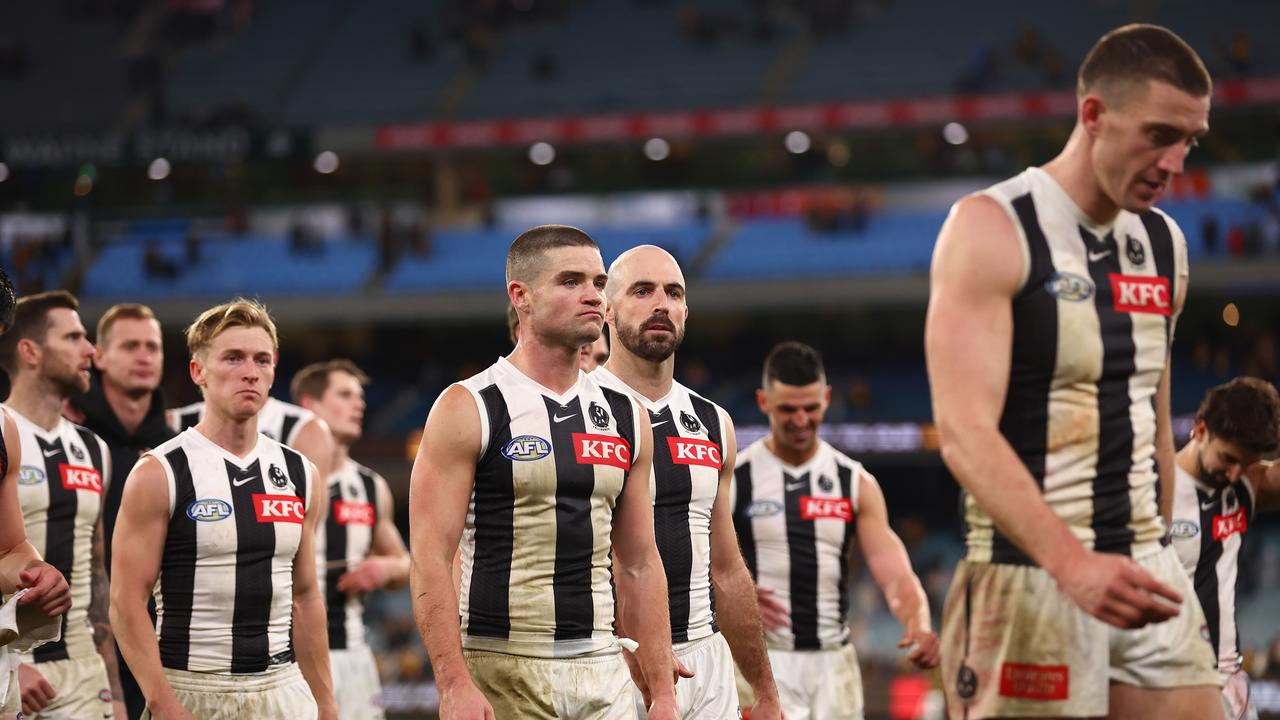 MELBOURNE, AUSTRALIA - JULY 20: The Magpies look dejected following the round 19 AFL match between Hawthorn Hawks and Collingwood Magpies at Melbourne Cricket Ground on July 20, 2024 in Melbourne, Australia. (Photo by Graham Denholm/AFL Photos/via Getty Images)