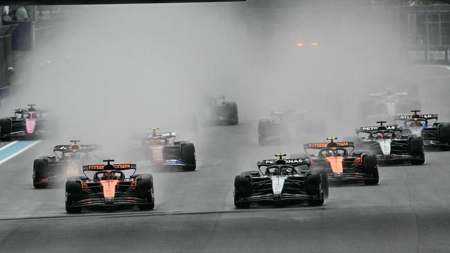 Oscar Piastri and Andrea Kimi Antonelli race into Turn 1. Photo by Chandan Khanna / AFP.