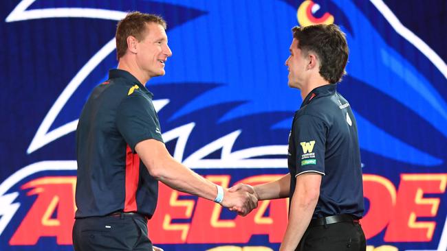 Adelaide’s pick 16 pick Ned Mchenry with Brett Burton. Picture: AAP