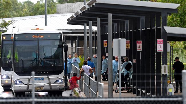 The first group of Australian evacuees from Wuhan Province in China arrive via bus at the former Inpex workers’ village in Howard Springs earlier this month. Picture: Che Chorley