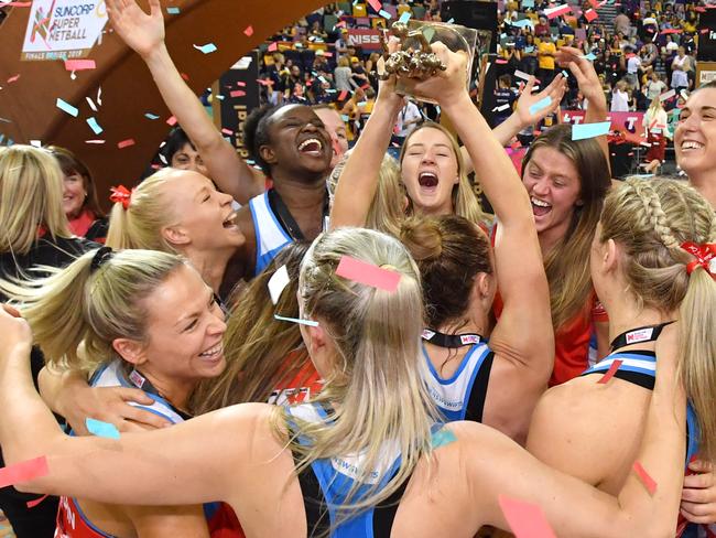 Swifts players celebrate winning the Super Netball Grand Final match between the Sunshine Coast Lightning and the New South Wales Swifts at the Brisbane Entertainment Centre in Brisbane, Sunday, September 15, 2019. (AAP Image/Darren England) NO ARCHIVING, EDITORIAL USE ONLY