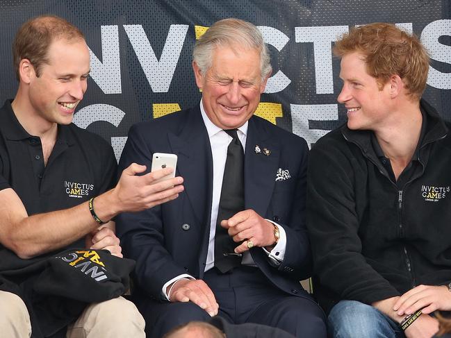 Happier times. A united Prince William, King Charles and Prince Harry at the Invictus Games in 2014. Picture: Getty Images