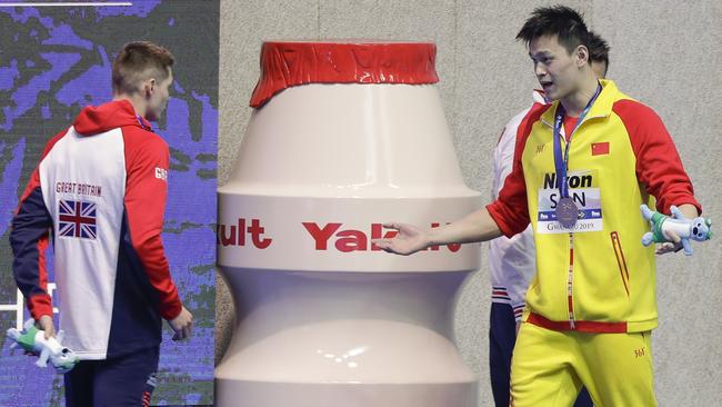 Sun Yang confronts Great Britain swimmer Duncan Scott at the World Championships.