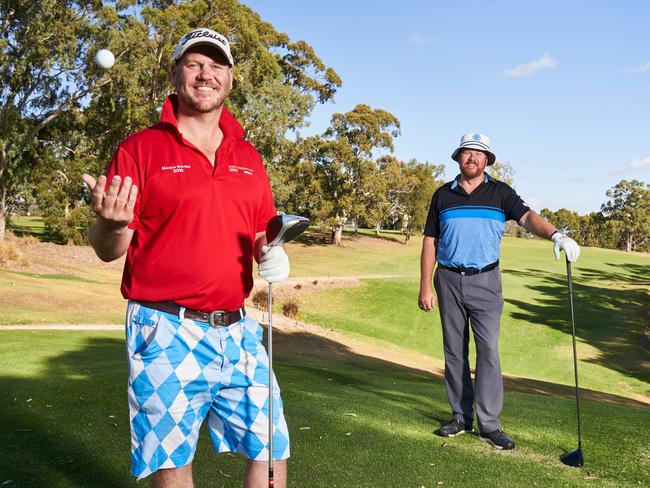 Club president, Nathan Gray with Ian Pritchard at Mount Osmond Golf Club, which is open for groups of two despite Golf Australia recommending a closure of all courses due to COVID-19, Tuesday, March 31, 2020. Picture: MATT LOXTON