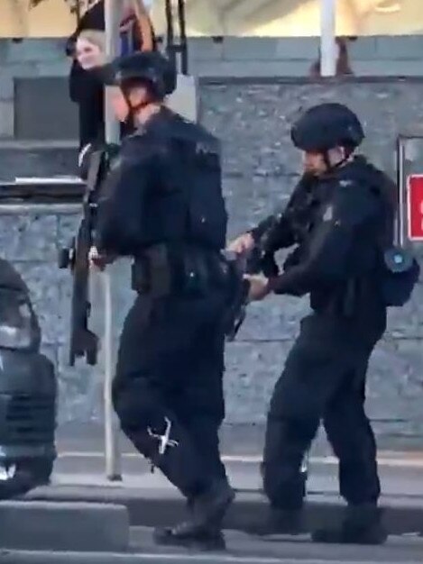 Critical response team officers walking into Flagstaff station. Picture: Twitter @ddeezy4