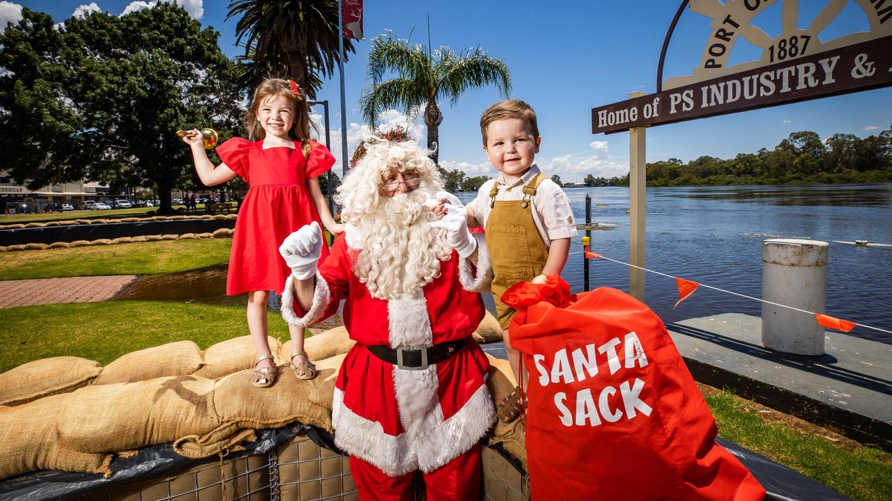 Portia, 4, and Hugo, 2, with Santa at the Port of Renmark. Picture: Tom Huntley